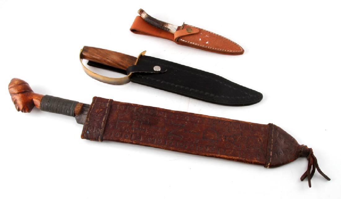 VINTAGE AND NEW MACHETE BOWIE KNIFE LOT: Includes Machete Bolo blade measures 16 1/2 inches, homemade leather scabbard has wear from age, wooden hilt wrapped with wire, pommel designed with face light wear, overall in very good condition. Ci
