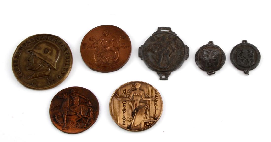 7 GERMAN WWII TABLE AWARDS AND DONATION MEDALS: 7 German WWII table awards & donation medals. Includes 14th Panzer division table award, Der Wucherer 1st table medal, 3 WHW war donation medals, 1914 table award, and 1936 Berlin Summer Olympics tabl