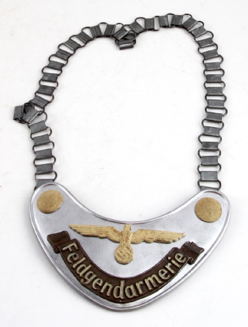 GERMAN WWII ARMY FIELDZHANDARM GORGET W CHAIN: Has "RZM" and other maker's markings. Measures approx. 6.5 inches across. Chain is 23.5 inches. Some age wear present. Unauthenticated. Sold "as is". This lot has a reserve.