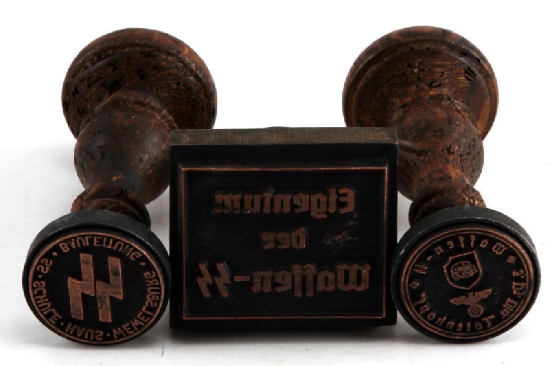 WWII GERMAN WOOD WAFFEN SS DEATHHEAD HAND STAMP: Lot of THREE (3) includes: Waffen SS property, SS School of Memelsburg, Waffen SS division "Totenkopf". Some normal age wear present. Unauthenticated. Sold "as is". This lot has a reserve.