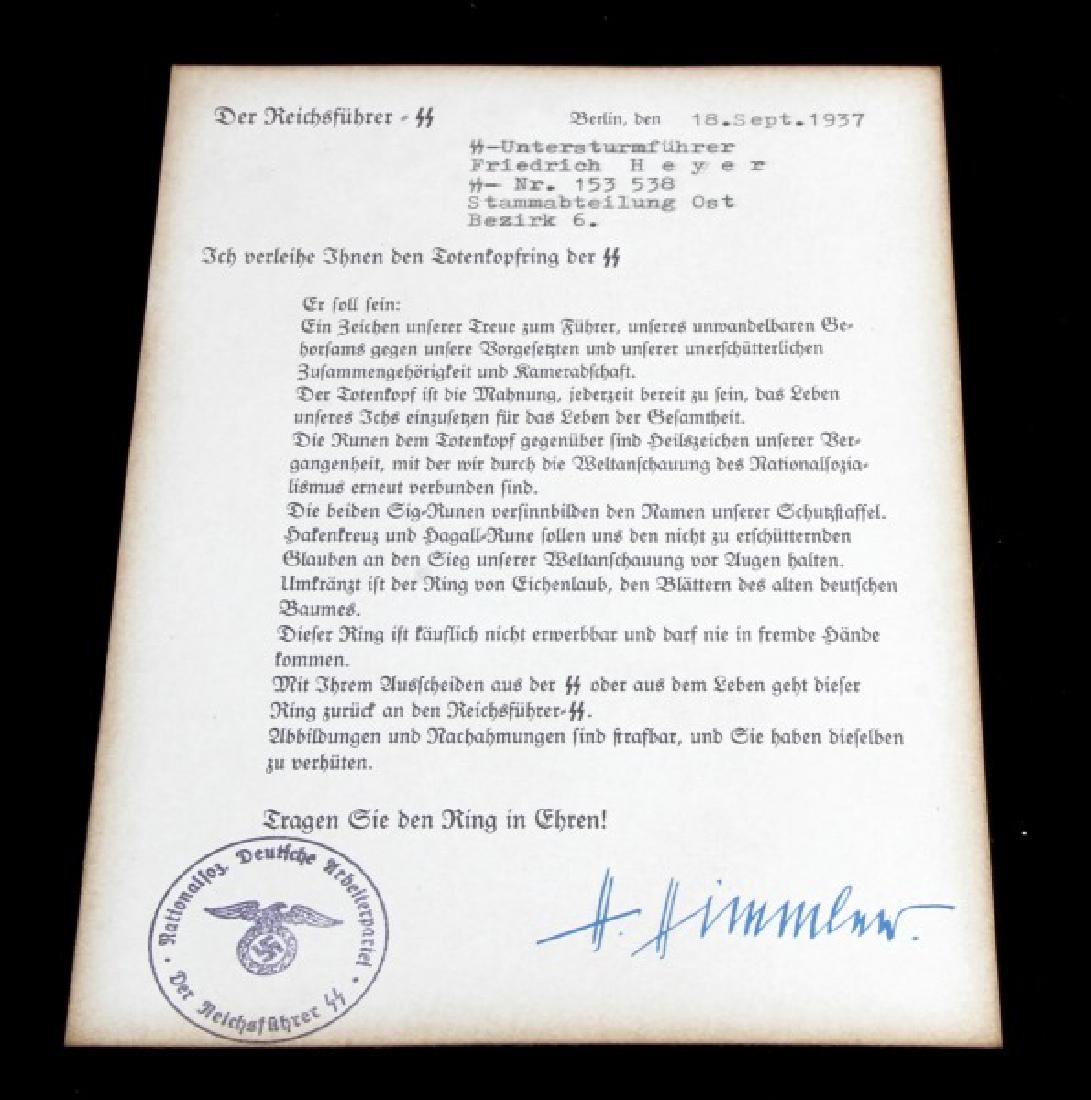WWII GERMAN SS HONOR RING AWARD CITATION HIMMLER: German WWII Third Reich period SS Honor Ring citation. Has printed signature of Heinrich Himmler. Some light age wear. Measures 8 x 5.5 inches. Unauthenticated. Sold "as is".