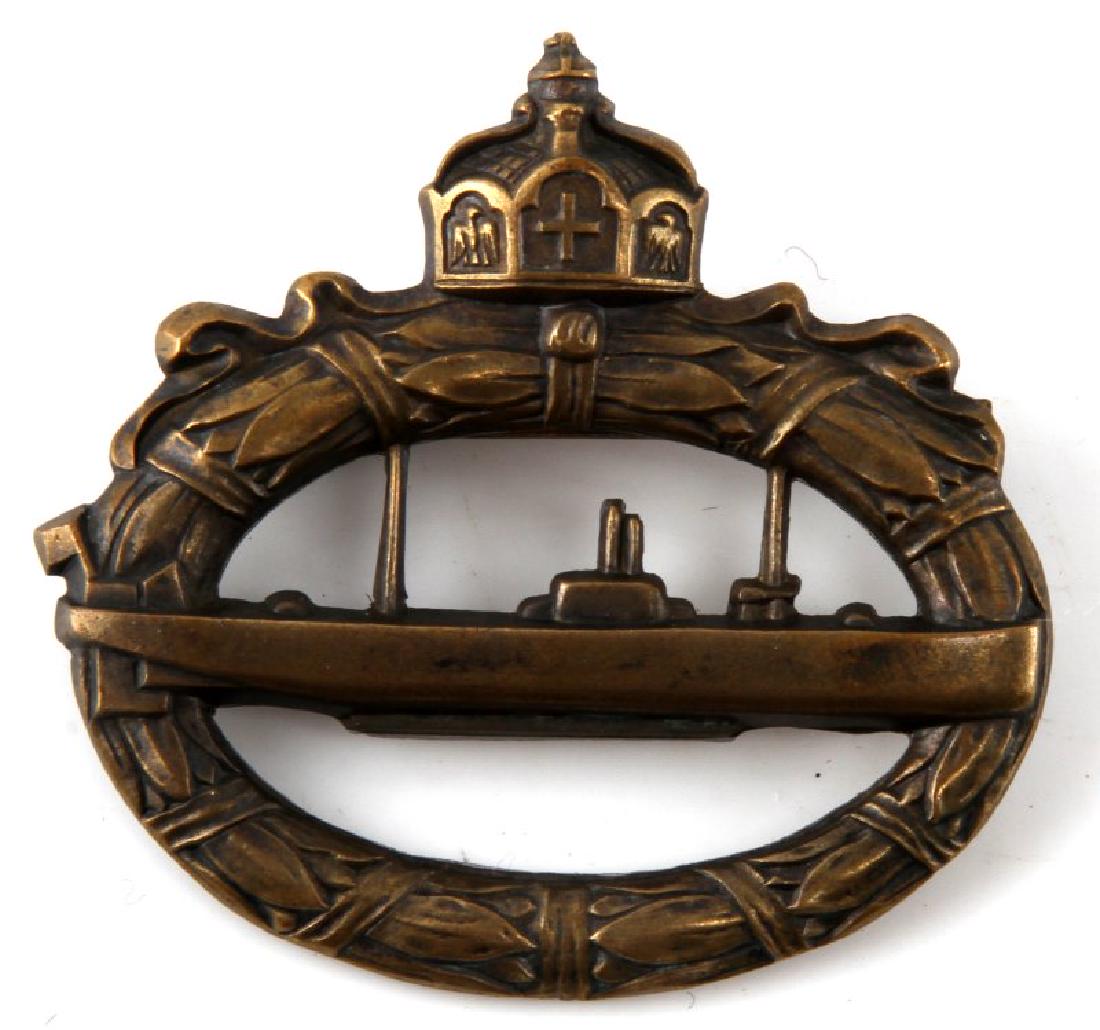 WWI IMPERIAL KRIEGSMARINE ENLISTED U BOAT BADGE: Enlisted version in heavier cannon brass. Maker mark Walter Schott fec. This lot has a reserve.