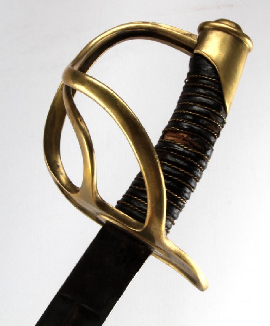 US ARMY MODEL 1860 LIGHT CAVALRY SABER SWORD: An M1860 Light Cavalry Saber of the US Army, with the slogan "In Treue Fest" on both sides of the blade. Does not include the scabbard. In good condition, with some wear on the leather of the grip, an