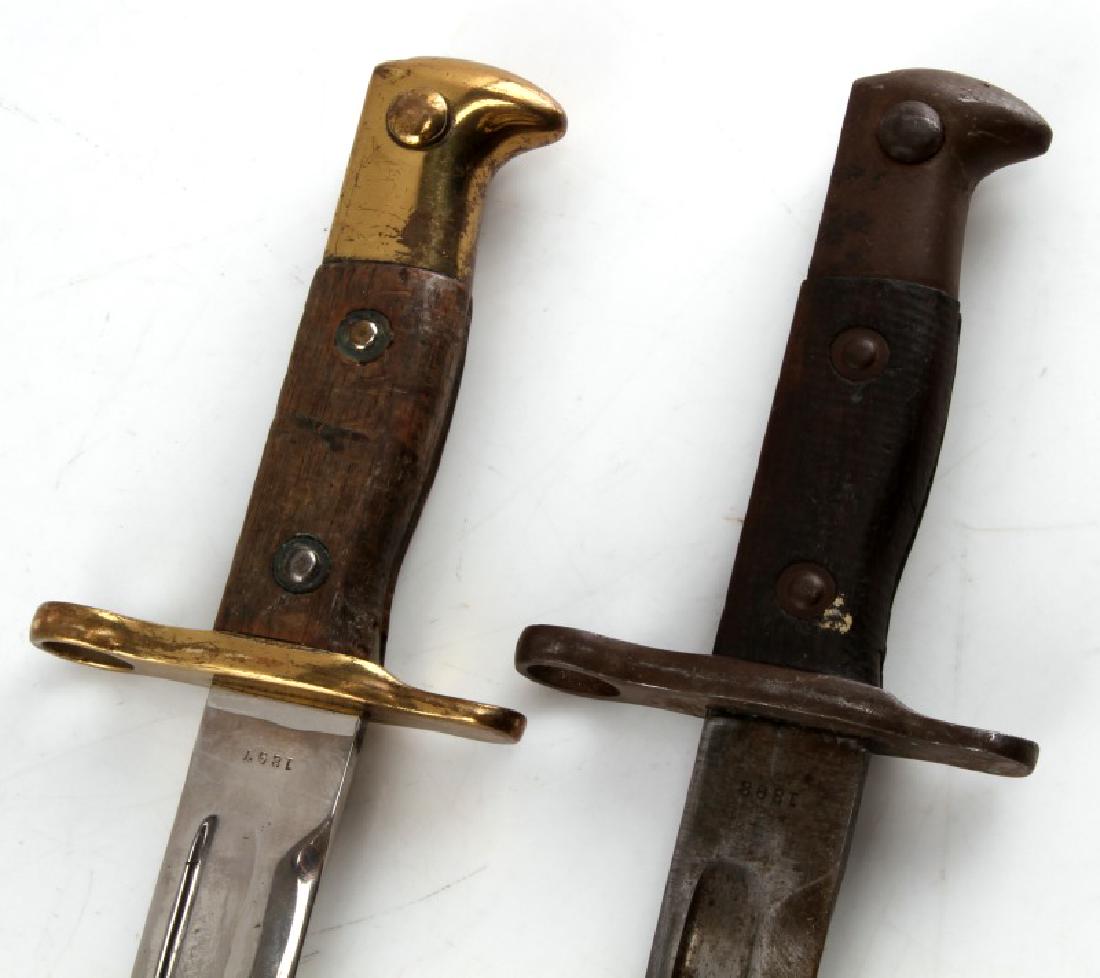 US ARMY 1897 1898 KRAG JORGENSON BAYONET LOT OF 2: Lot of two US produced Krag-Jorgensen service rifle bayonets. One is marked 1897 and has bright brass fittings and highly polished blade, probably dress edition. The other is an 1898 model with blued 