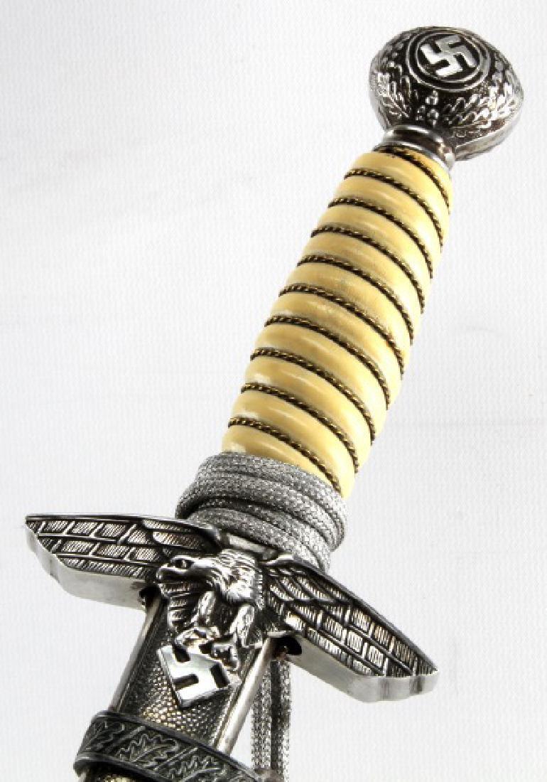 WWII GERMAN 3RD REICH LUFTWAFFE DAGGER & SCABBARD: Complete with scabbard, suspension ring, hangers and portepee. Measures 17 inches in scabbard with a 10 inch blade. Blade is marked C. Gustav Spitzer Solingen. Blade fits snug in scabbard. Hangers sho
