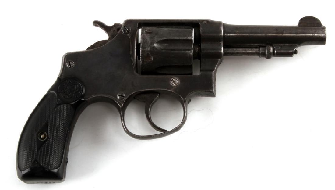 SMITH & WESSON .32 CALIBER LONG CARTRIDGE REVOLVER: Handle measures 3 inches in vertical length while the barrel measures 3 inches in length while the cylinder is 1.2 inches in length. Bore is dark with some pitting. Handle insert is black with a check