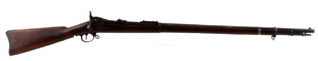 US SPRINGFIELD M1884 TRAPDOOR RIFLE .45 70 CALIBER: 1892 manufacture. Clear markings to barrel, breech, trapdoor, and lock plate. Scattered patina throughout but smooth. Barrel measures 32.5 inches long with dark bore (some pitting), fixed front and Bu
