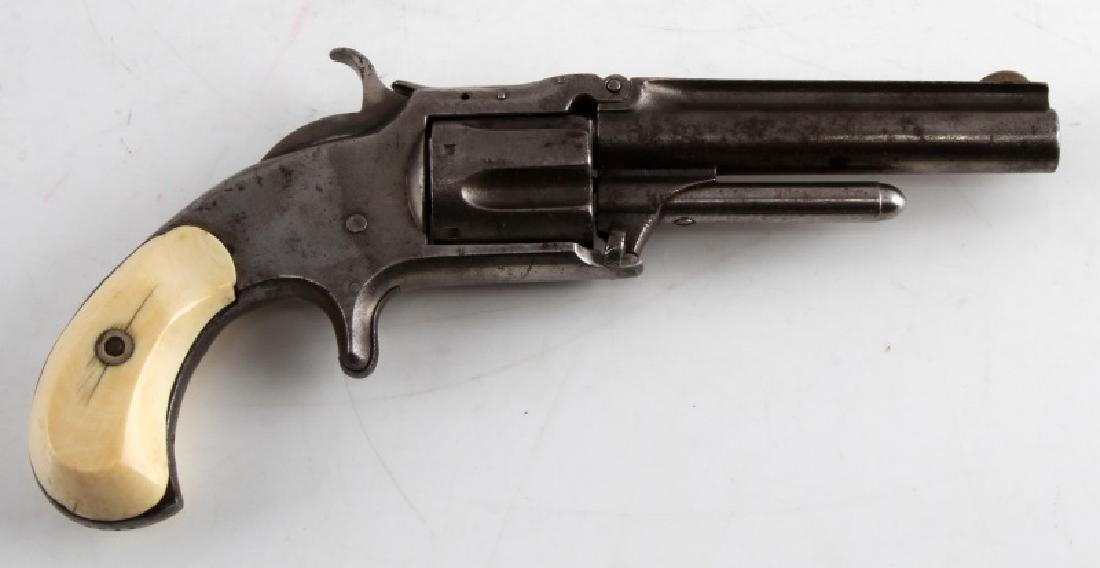 SMITH & WESSON MODEL 1 1/2 REVOLVER .32 RF 1866: Tip-up 5 shot revolver made from nickel steel with tusk grips. One line maker and patent dates marked to top rib with Nov 21, 66 as the last. Round barrel measures 3.5 inches with good bore, little pi