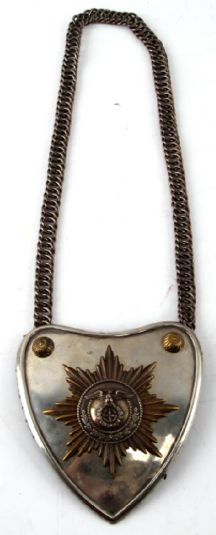 WWII GERMAN THIRD REICH SA GORGET WITH RZM CONTROL: SA Gorget with chain. Uncleaned. Black cloth on reverse with metal RZM issue tag. This lot has a reserve.