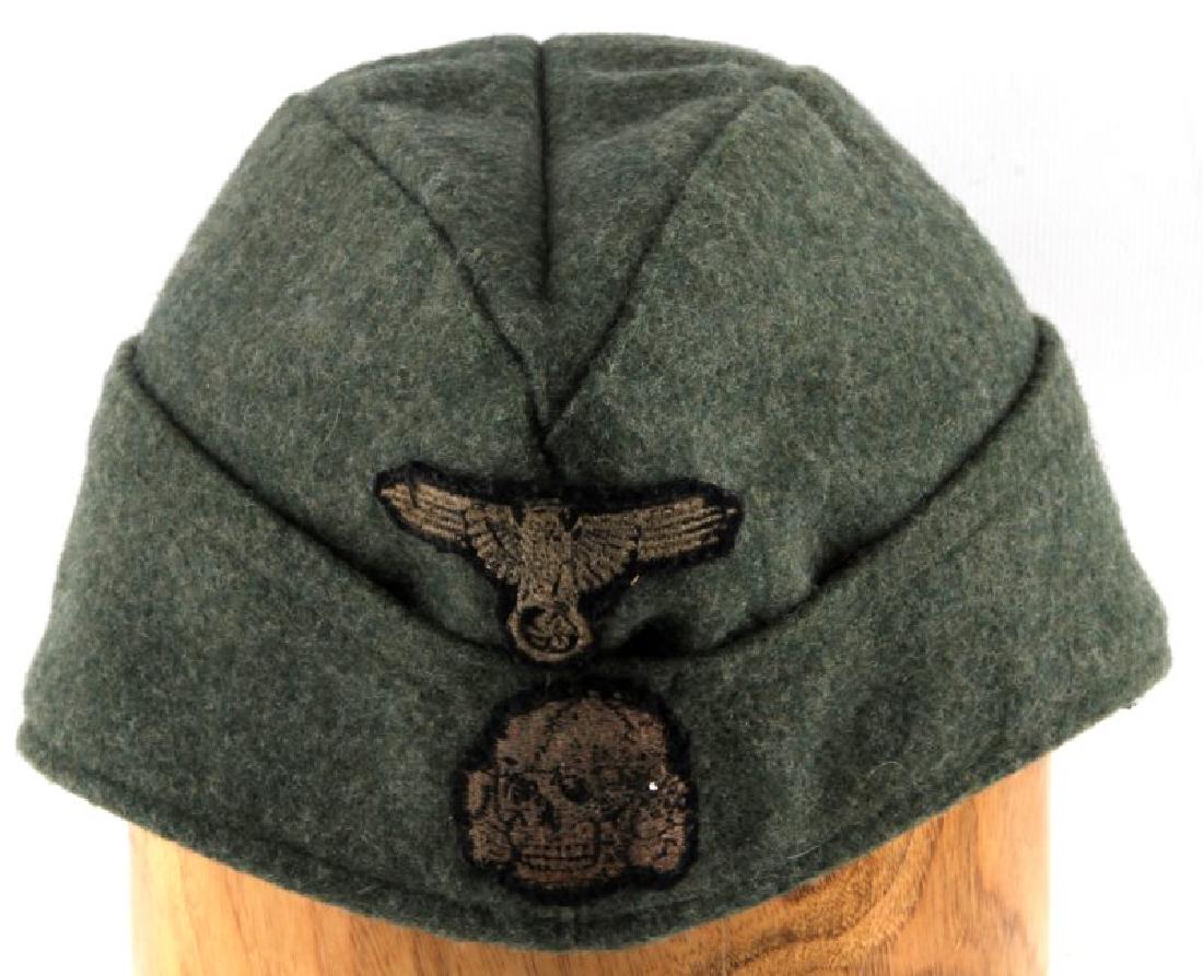GERMAN WWII WAFFEN SS OVERSEAS CAP WITH NAME: German WWII Waffen SS Overseas cap. Double decal on front face. No mothing. Interior bears eagle stamp & hand written name "Uscha. Beck". Division hand written underneath but is non-legible. Interior 