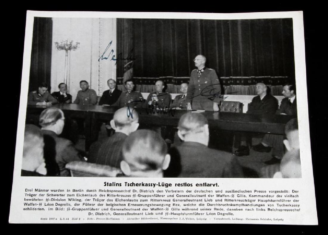 GERMAN WWII PRESS PHOTO W SEPP DIETRICH AUTOGRAPH: Dated 1944 press photograph 9 by 7 inches, 3 signatures including Leon Degrille and Sepp Dietrich.