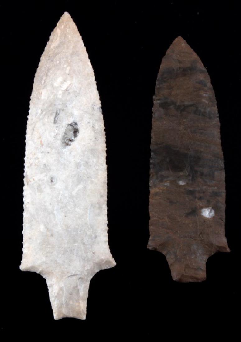 NATIVE AMERICAN CHERT ARROWHEAD LOT OF TWO: Lot of 2 Chert Native American Arrowhead. First one is Delhi point measuring 5 inches, oblique transverse flaking pattern. Second is also a Delhi point measuring 6 inches with a random flaking pattern