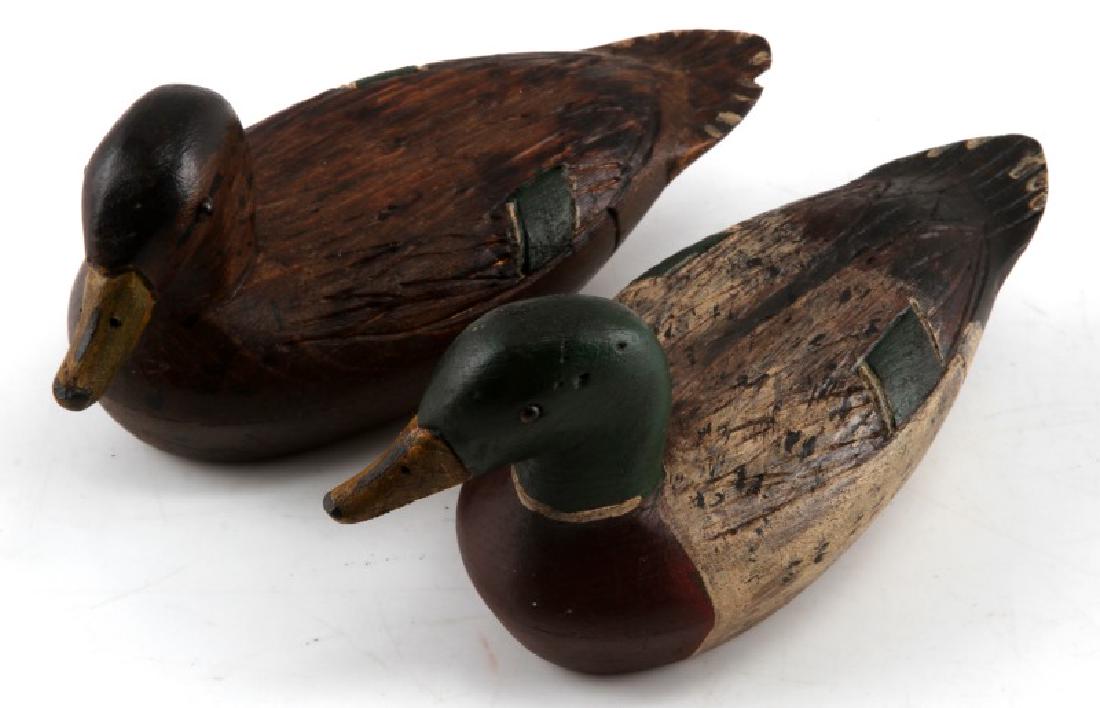 MINIATURE ED SMITH WOODEN MALLARD DUCK DECOY LOT: Lot contains two carved miniature wooden duck decoys, a male and female mallard. Both have the name Ed Smith carved on the bottom. They both measure roughly 6 inches in length, and are in very good co