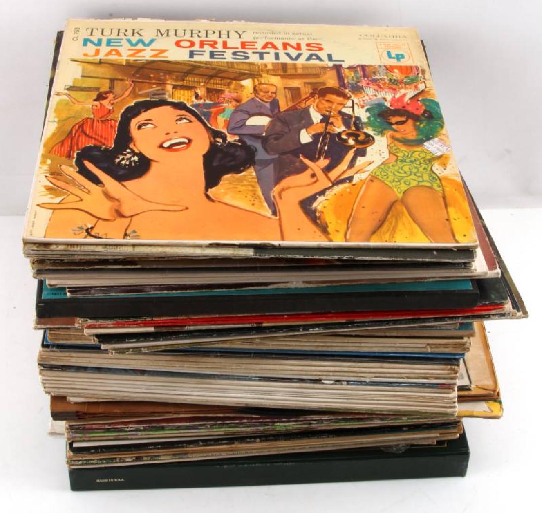 LOT OF OVER 60 VINTAGE TO ANTIQUE VINYL RECORDS: Grouping of over 60 vintage to antique vinyl records which appear to be from various eras with vinyl records such as : The Sound Of Music, The Nut Cracker, Smothers Brothers, Marvin Gaye, Bob New Hear