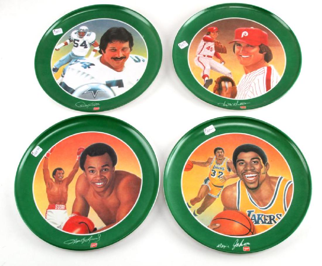 LOT OF 4 GREATEST ATHLETES OF ALL TIME 7 UP PLATES: Grouping of 4 Vintage Greatest Athletes of all time 7UP hard- plastic collector plates measuring 10 inches in diameter which include Magic Johnson, Sugar Ray Leonard, Randy White, and Paul Rhodes. Ite