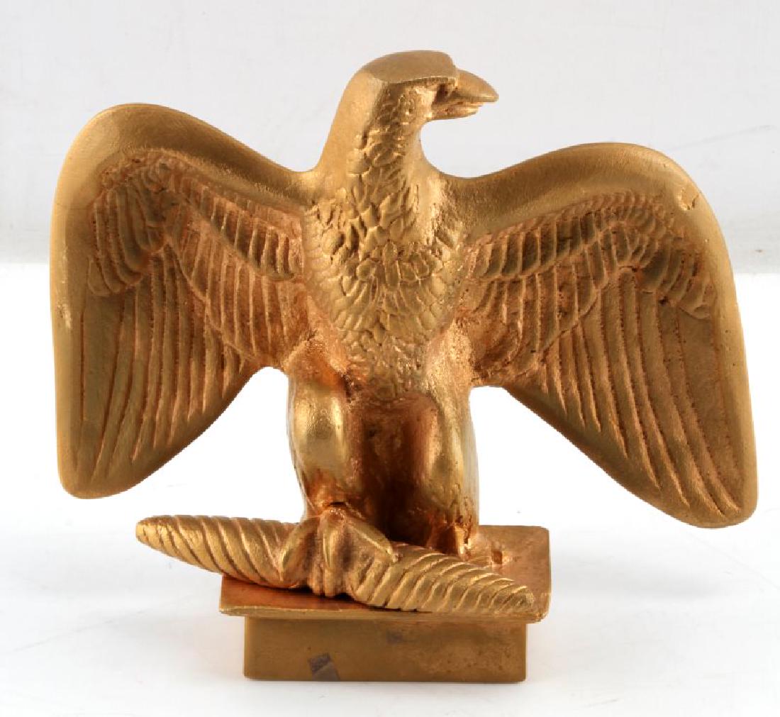8 INCH GILT METAL FLAG FEDERAL EAGLE FINIAL TOPPER: Metal alloy (zinc?) painted in a golden color. Natural metal color appears to be showing through in a few small areas. Good detail. No makers markings. Stands approx. 8 inches tall with a 8.75 inch wi