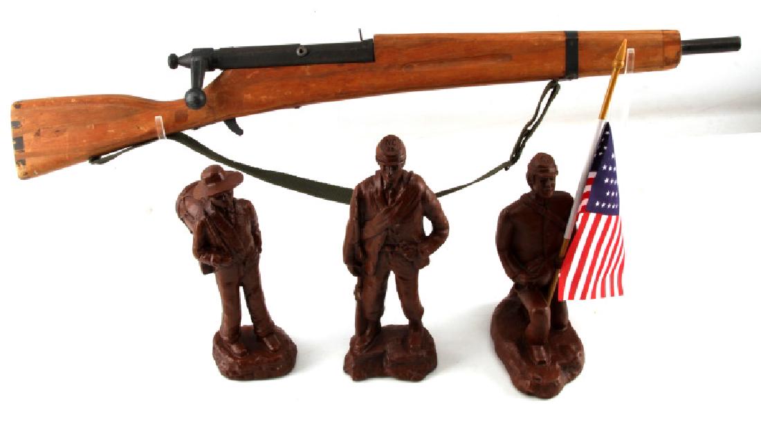 WOODEN TOY CIVIL WAR SOLDIERS AND WOODEN TOY RIFLE: 3 toy soldiers 1 holding a flag 1 holding a rifle and the last is a boy with a drum on his back. All are in very good condition. 1 wood rifle that shows heavy signs of age and use.