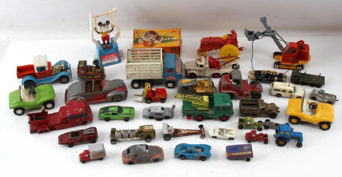 30 VINTAGE TOY LOT LESNEY TOOTSIETOY MICKEY MOUSE: Lot of approximately THIRTY (30) vintage toys, mostly die cast cars. Age wear and paint loss present. Some are not complete and some may be damaged/not working. Wheels on a few vehicIes do not stay on