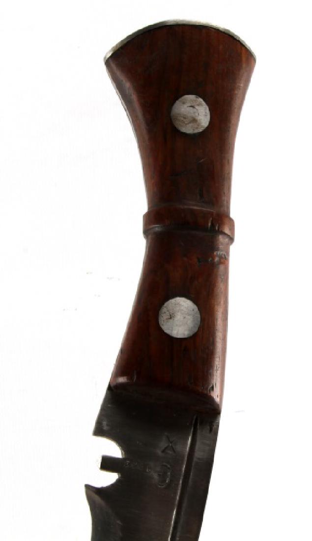 VINTAGE NEPALESE GHURKA KUKRI KNIFE AND SCABBARD: Kukri knife with a leather scabbard. The blade is marked 'G1903 X' on one side and 'WSC 1958 3' on the other. Measures 17 inches long and in very good condition, with the scabbard showing some signs o