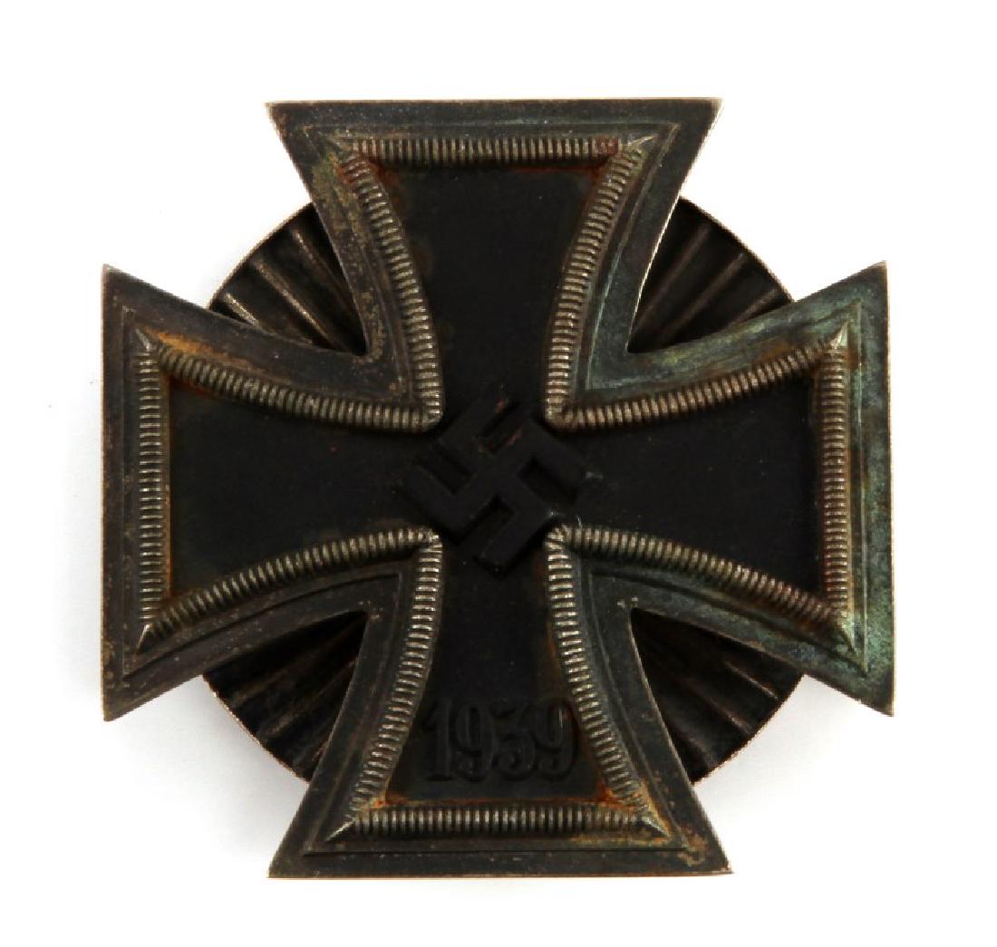 WWII GERMAN THIRD REICH IRON CROSS 1ST CLASS: Uncleaned screwback type. No makers marks. 3 piece construction with magnetic core. Unauthenticated sold as is. This lot has a reserve.