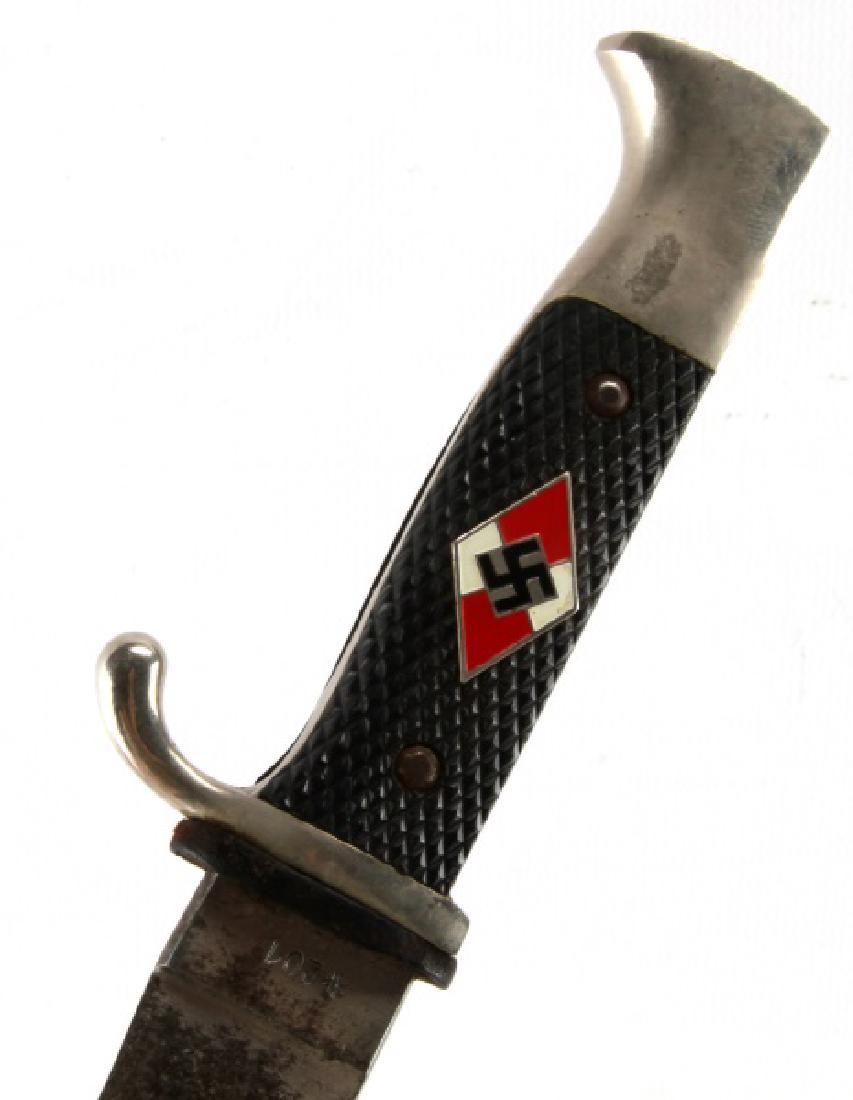 WWII GERMAN THIRD REICH HITLER YOUTH KNIFE: Hitler Youth knife with bakelite handle, painted black steel sheath, and leather hanger with snap. In very good condition, with the grip being slightly loose, minor chipping of the paint on the scabba