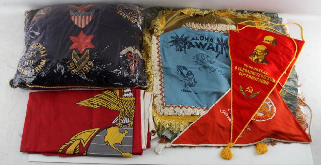 ASSORTED MILITARY PILLOW CASE FLAG & PENNANT LOT: Embroidered feild hospital pillow, 3 Russian Pennants, vintage U.S. Maries flag (34 by 56 inches) with some fading of color, 3 silk Sweetheart/Friendship souvenir pillow cases, a silk Shellback souven