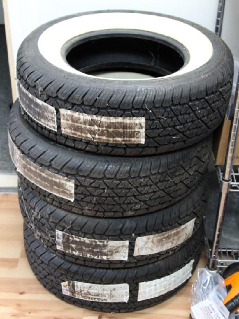 BF GOODRICH SILVERTOWN RADIAL WHITE WALL TIRE SET: Set of 4 BF Goodrich Silvertown Radial white wall tires. Model P215/70r14. In very good condition, unused, with minor yellowing of the white on the tires.