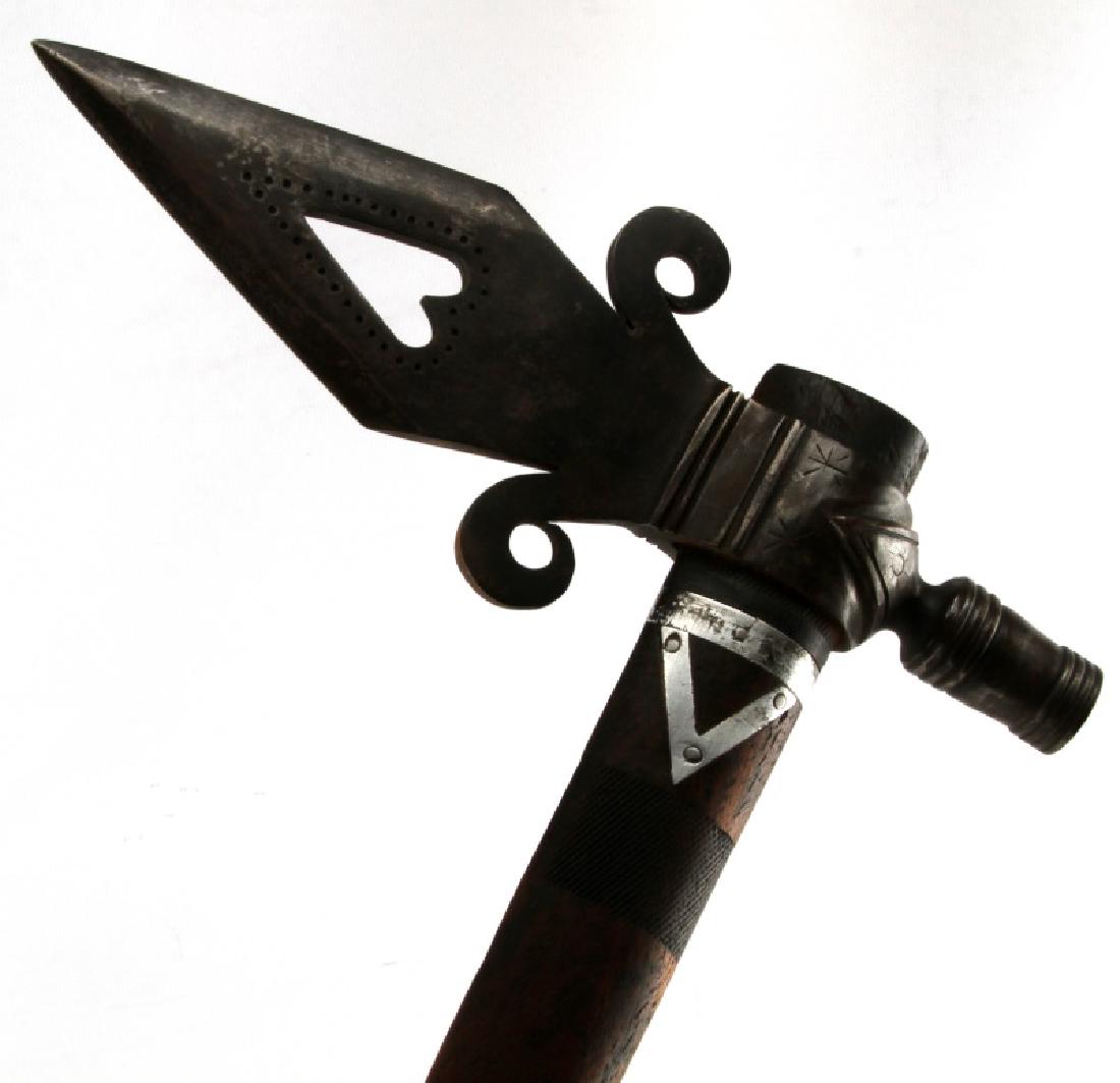 ANTIQUE NATIVE AMERICAN FUR TRADE PIPE TOMAHAWK: Wood handle measures 23 inches long with a 11 inch metal head. The head has a heart shape hole and star and moon design pattern. The tip has a hole to smoke as a pipe.