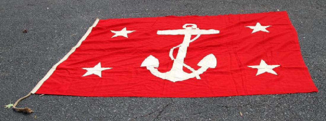 US UNDER SECRETARY OF THE NAVY RED FLAG: Red flag with four stars and fouled anchor of the US Undersecretary of the Navy. Measures roughly 59 by 80 inches. Very good condition overall.