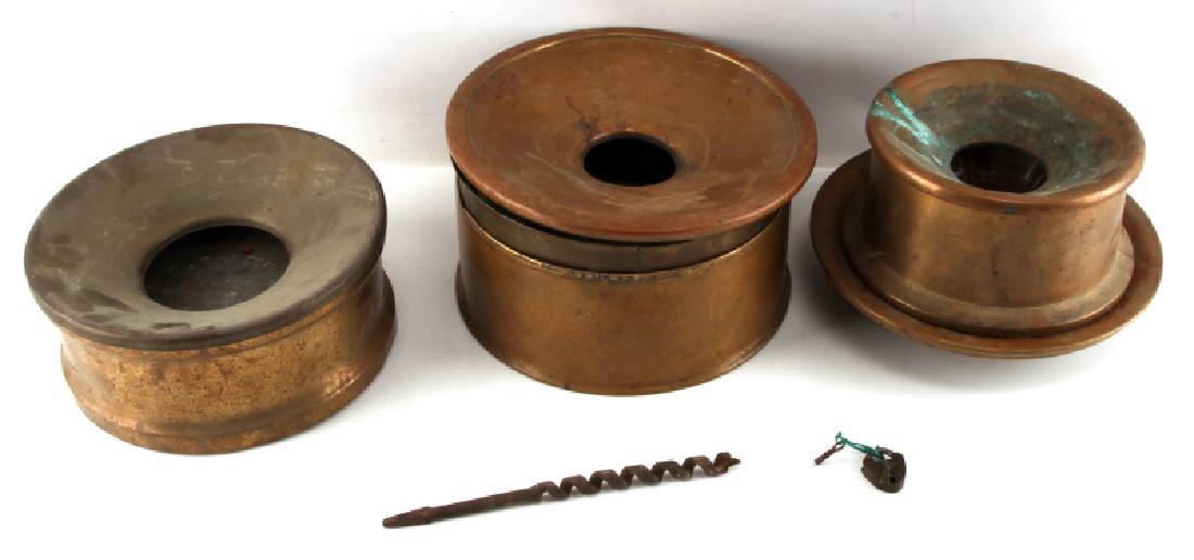 ANTIQUE BRASS SPITTOON LOT OF THREE: Three antique brass spittoons, along with an additional lid. In fair condition, with some corrosion and wear from the age of the items. One measure 10 1/2 inches across, and is marked 'JR Gibney' on t