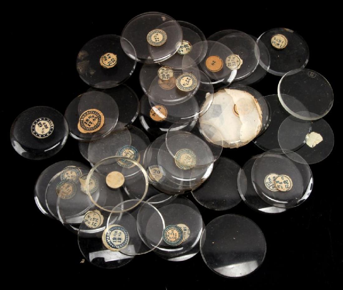 GROUPING OF 45 VINTAGE TO ANTIQUE WATCH CRYSTALS: Lot of 45 vintage to antique watch crystals of various manufacturer's, and sizes with stickers denoting sizes. Items are in good condition despite any minor chipping or any other detraction.