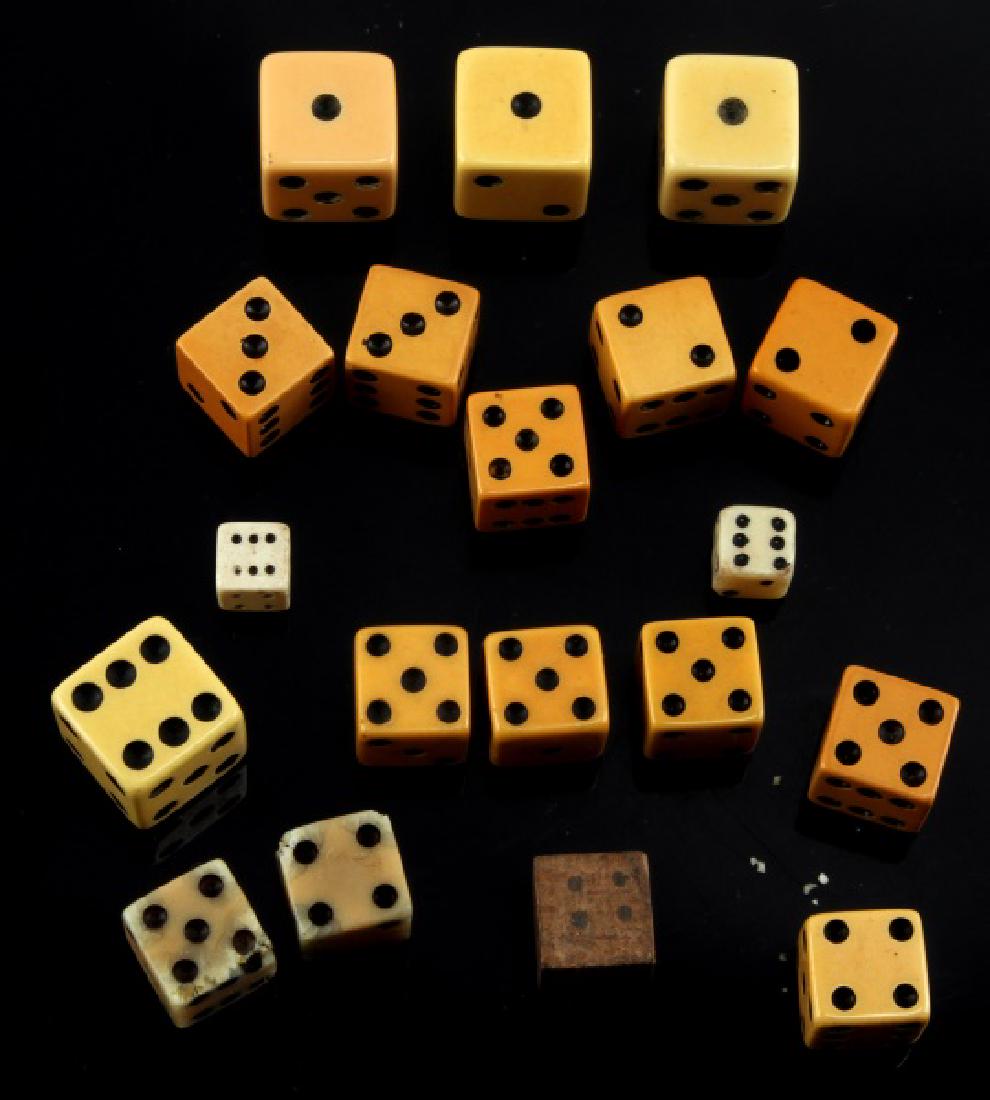 19 MID CENTURY ASSORTED GAME DICE LOT: Lot of NINETEEN (19) vintage or older game dice. Dice range in size from 3/8 inch to 3/4 inch. One die is wooden. Some normal age wear and discoloration present. All in good, used condition.