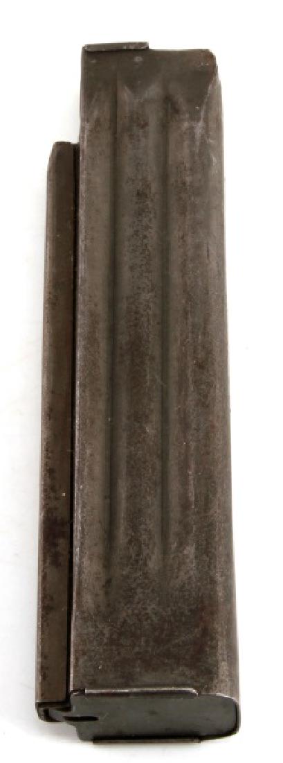 M50 REISING 30 ROUND .45 CAL MAGAZINE: A M50 Reising 30 round .45 caliber magazine. Light tarnishing. Side reads "H & R - REISING Model 50 - CAL 45 MAGAZINE HARRINGTON AND RICHARDSON ARMS CO. WORCESTER, MASS USA". VG condition.