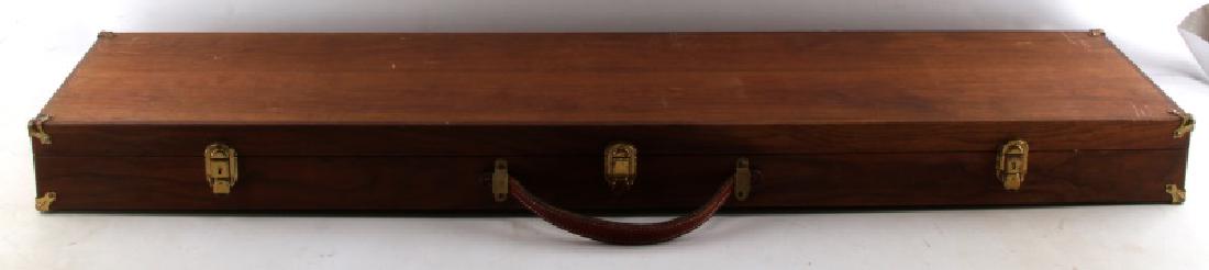 CUSTOM LONG GUN WOODEN LOCKING CASE WITH KEY: Walnut presentation case in good condition. Does have some scratches and discoloration to the wood. Has two keys. Measures 48 inches long by 11 inches wide.