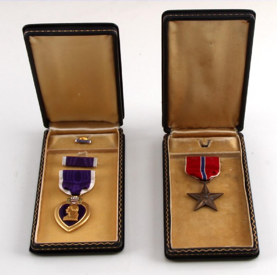 US WWII PURPLE HEART & BRONZE STAR WITH CASES: US WWII Purple Heart and Bronze Star medals. Both with the original coffin cases. Light wear and tarnishing but each shows an overall VG condition.