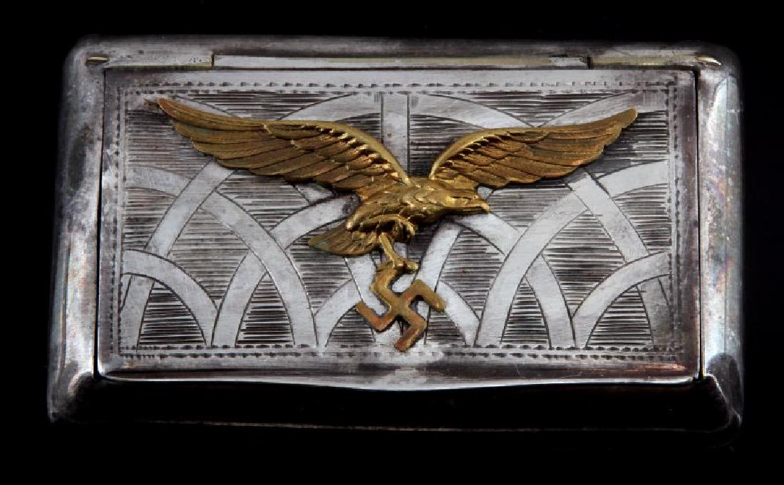 GERMAN WWII LUFTWAFFE PILOT TOBACCO BOX: Measures approx. 3.75 x 2.25. Solid construction. Some age wear and tarnish present. Unauthenticated. Sold "as is". This lot has a reserve.