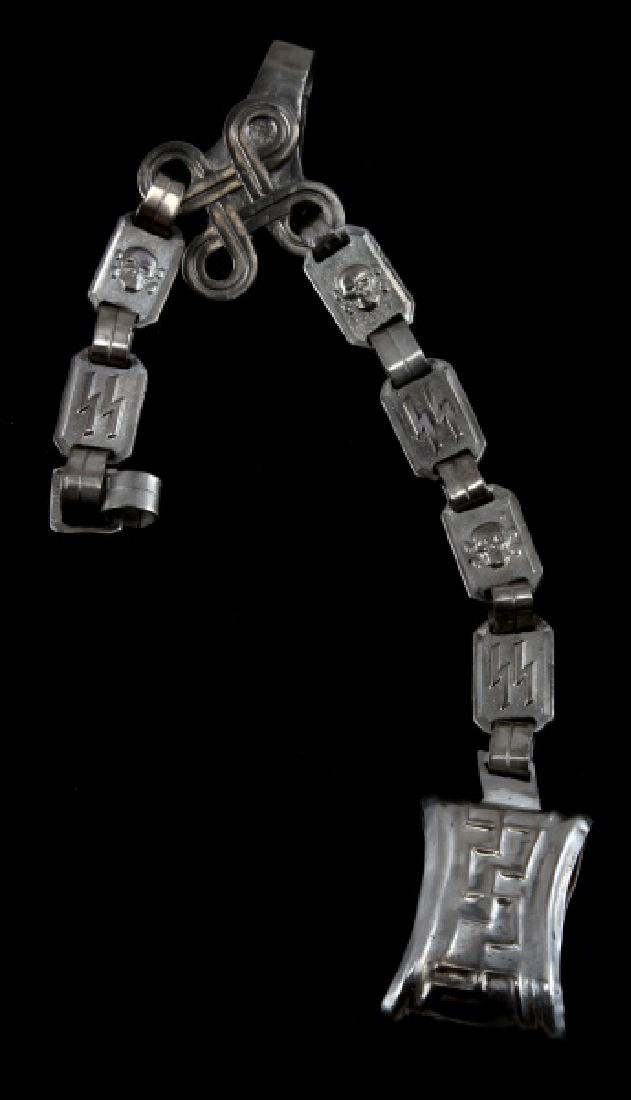 GERMAN WWII THIRD REICH SS DAGGER HANGER: Alternating double runes and totenkopf designs on each link has swastika design on front and maker's mark on reverse. Some normal age wear. Unauthenticated. Sold "as is". This lot has a reserve.