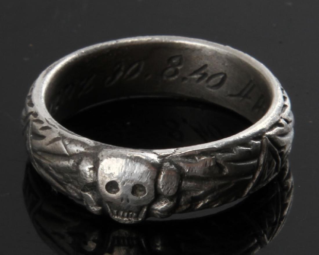 GERMAN WWII SS HONOR SILVER RING HIMMLER SIGNATURE: Size 11. Has signature of Himmler, date of the award, and name of the recipient engraved inside of the ring. Unauthenticated. Sold "as is". This lot has a reserve.