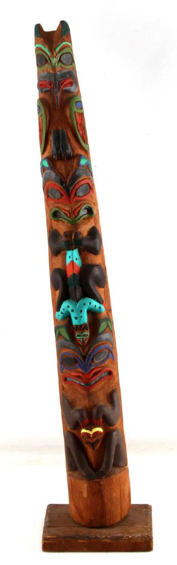 TOTEM POLE PACIFIC NORTH WEST NATIVE AMERICAN: Totem Pole from the pacific north west. Cedar construction. Broken base. Measures 27" in height. G condition.