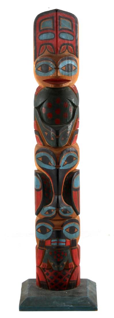 ALASKAN NORTHWEST NATIVE INDIAN TOTEM POLE: Polychrome Copper woman frog totem measuring 18 1/2 inches in height. In good condition. Faint stamp on reverse reads Hand made Alaska US Indian Arts & Crafts Board.