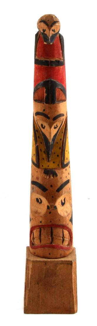 1908 ALASKAN NATIVE AMERICAN CARVED TOTEM POLE: Polycrome with period newspaper add from Ye Olde Curiosities Shop in Alaska. with From Mother 1908 marked on reverse. Measures 12 1/2 inches in height with minor loss of paint on raised edges.
