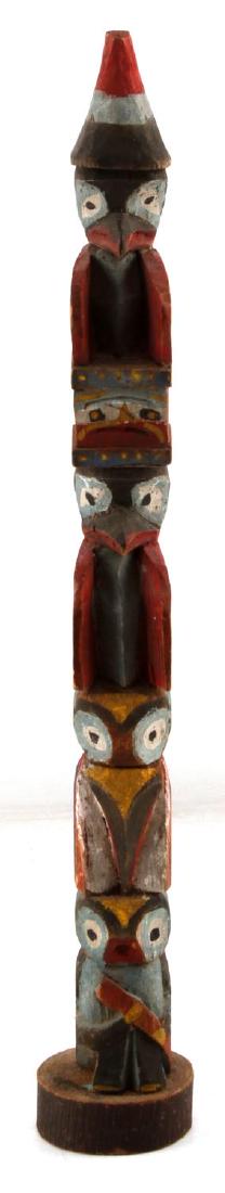 ALASKAN NORTHWEST INDIAN POLYCHROME TOTEM POLE: Early hand carved and painted measuring 17 inches in height. Some loss of color consistent with age.