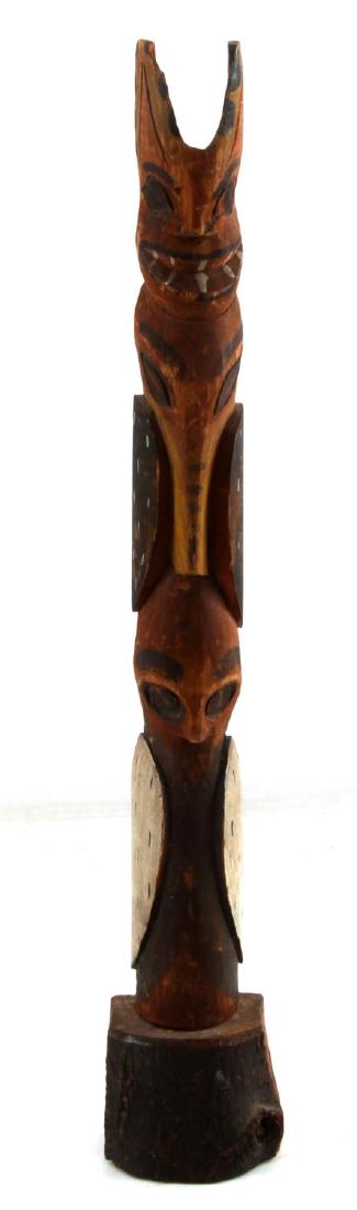 EARLY POLYCHROME NORTHWEST INDIAN TOTEM POLE: Polychrome colors used limited to red, black, ochre and white. Paint is considerably faded with some minor marring along high points.