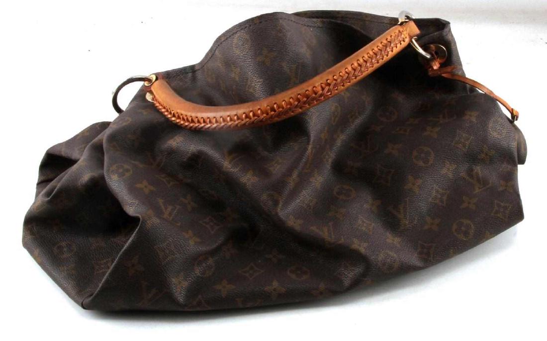 LOUIS VUITTON MONOGRAM ARTSY MM LEATHER PURSE: LOUIS VUITTON Monogram Artsy MM. This large tote is crafted of durable Louis Vuitton monogram coated toile canvas. This shoulder bag features a natural vachetta cowhide rolled leather handle with a sl