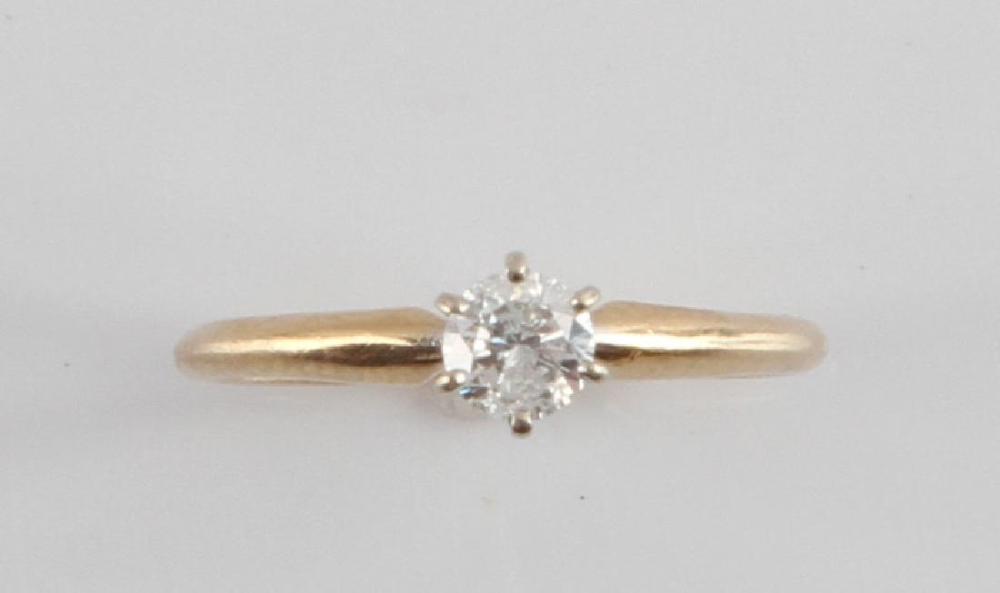 14KT GOLD 1/4CT DIAMOND SOLITAIRE ENGAGEMENT RING: Size 3 1/4, total weight 1 gram, 1/4 carat diamond, S clarity, J-K color.