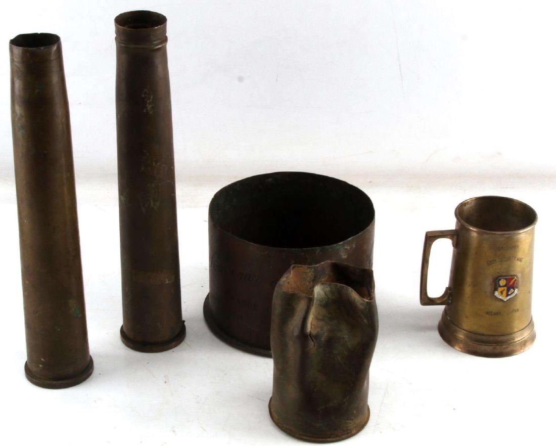 US MILITARY MULTI CONFLICT BRASS SHELLS & CUP LOT: All are just shells not active. Includes 2 40mm 1 75mm crimped, 1 155mm cut down and used for trench art and one marked Sayonara 6921 security wing Misawa Japan with a unit crest.