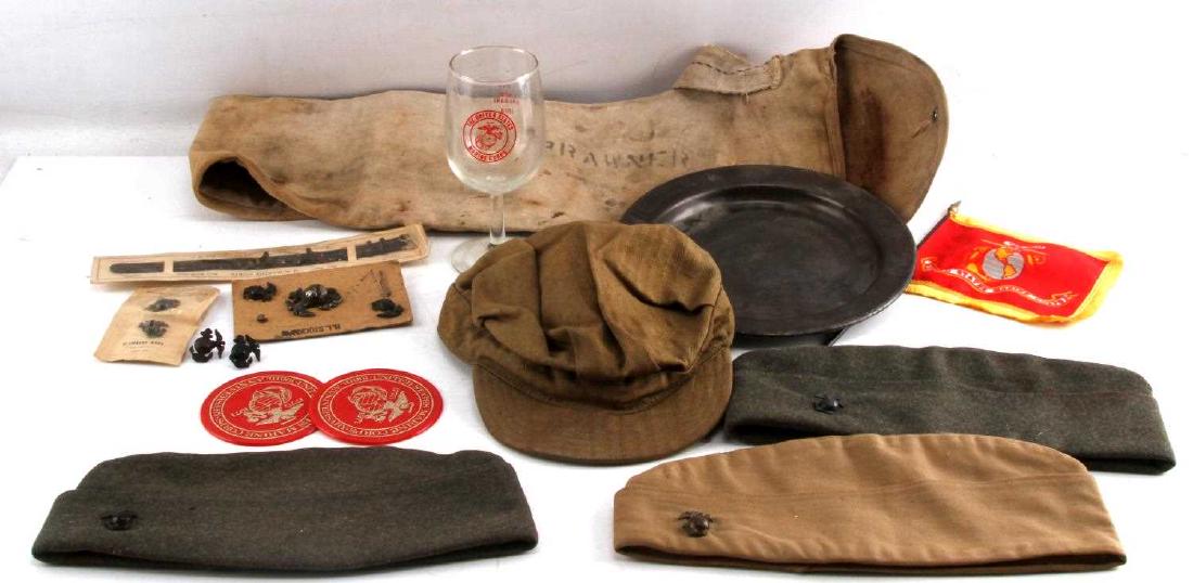 WWII EARLY COLD WAR US MARINE CORPS ITEM LOT: Includes a USMC side cap, multiple EGA insignia badges, Marine Corps anniversary items, and a Marine Corps flag, among other items. In good condition overall.