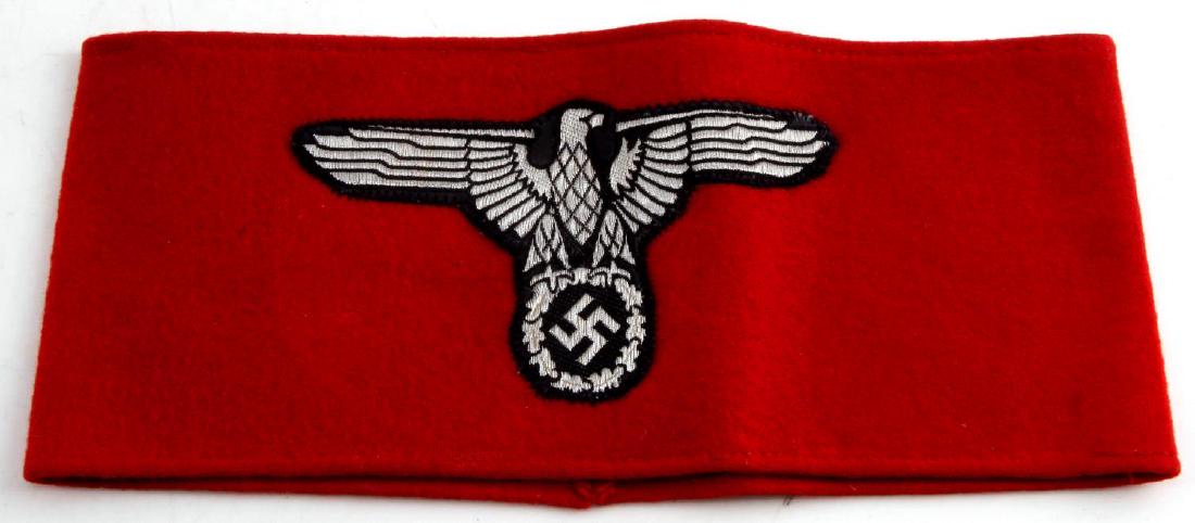 GERMAN WWII SS EAGLE ARMBAND WITH RZM TAG: German WWII SS "Eagle" armband. 2 minor mothing holes on reverse, 1 on front. Features silver bullion eagle and RZM tag on interior. VG condition. Unauthenticated, sold as is.