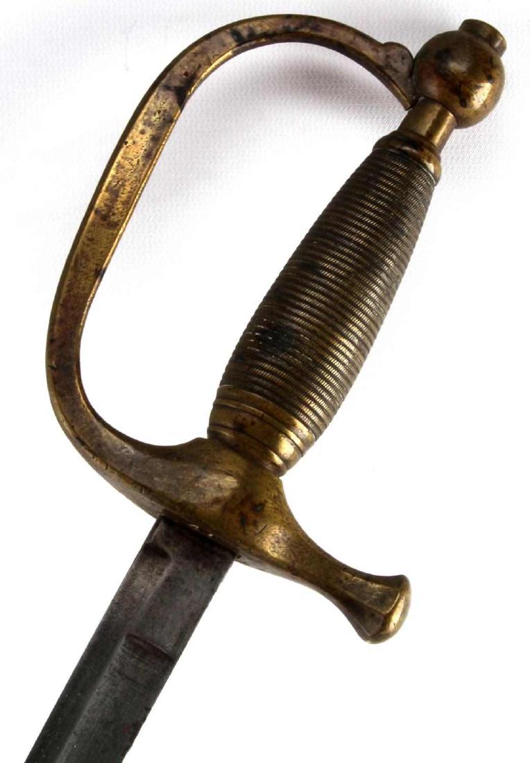 US ARMY MODEL 1840 MUSICIAN SWORD W/ SCABBARD: An 1840 model musician's sword, with a partial scabbard. No markings can be found on the sword, which measures just over 34 inches in length. Scabbard includes the upper brass portion and part of the 