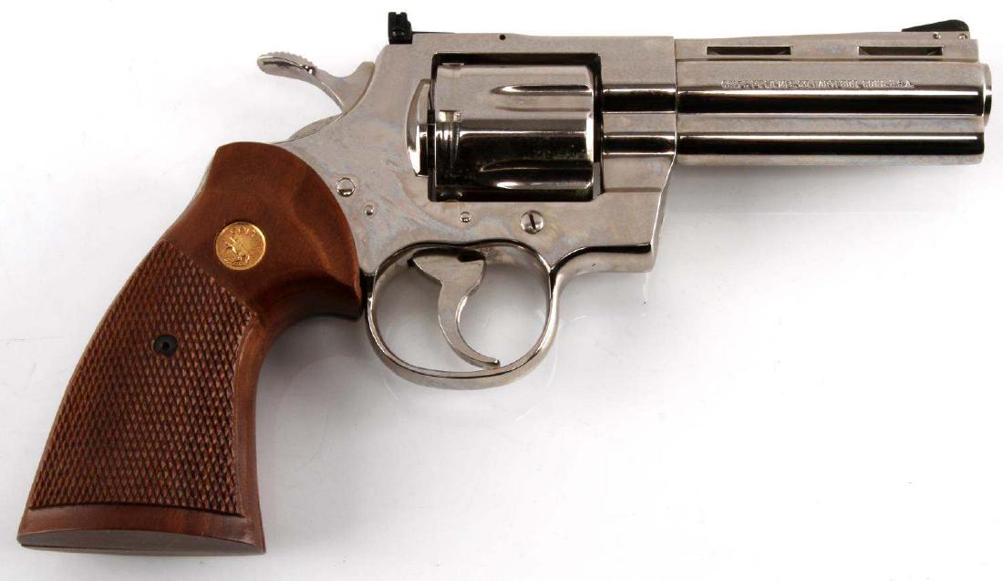 COLT PYTHON 357MAG REVOLVER NICKEL 4": Displays a 4" barrel with crisp and clean bore, adjustable sights, and wood grips. 6 shot revolver chambered in 357 magnum. Nickel finish is like new. Caliber: 357 Serial #: V99039